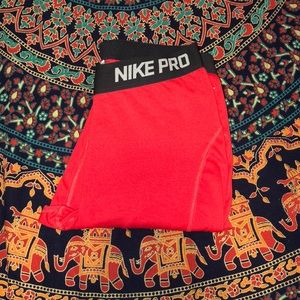 Red Nike athletic pants